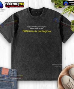 Smiling person wearing a 'Happiness is Contagious' washed t-shirt, spreading joy and positivity.