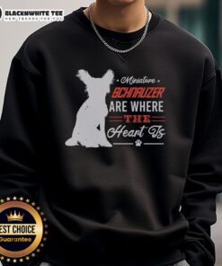 Cozy sweatshirt featuring a Miniature Schnauzer with the text 'Home is Where the Heart Is' for dog lovers.