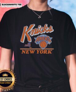 Vintage ladies tee featuring the New York Knicks logo in a stylish fly-by design, perfect for fans and casual wear.