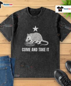 Good Opossum Come And Take It logo on a washed t-shirt, featuring a playful design perfect for casual wear.
