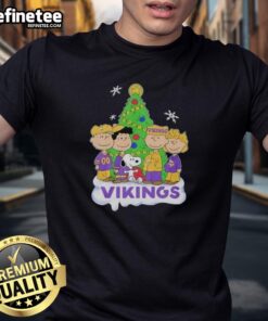 Good Peanuts characters celebrate Christmas in a Minnesota Vikings T-shirt, perfect for festive football fans.