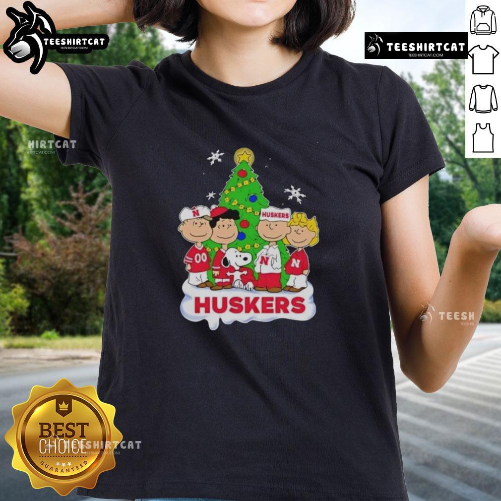 Good Peanuts Characters X Nebraska Cornhuskers Chrismas Ladies Tee Good Peanuts characters on a Nebraska Cornhuskers Christmas ladies tee, perfect for holiday sports fans.