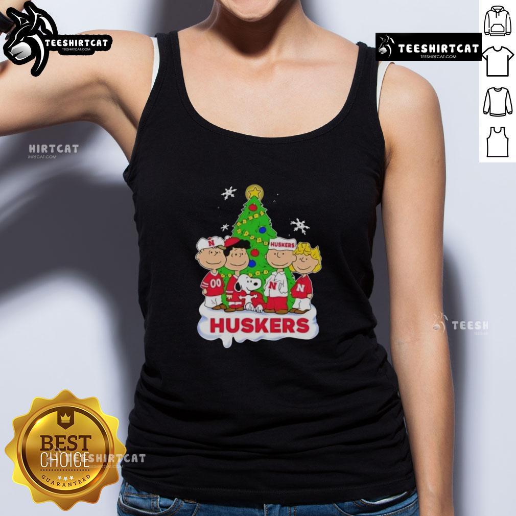 Good Peanuts Characters X Nebraska Cornhuskers Chrismas Tank Top Good Peanuts characters wearing Nebraska Cornhuskers Christmas tank top, festive design perfect for holiday fans.