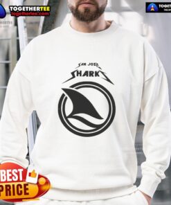 Fan wearing a cozy sweatshirt at a San Jose Sharks game day, showcasing team spirit and excitement for the match.