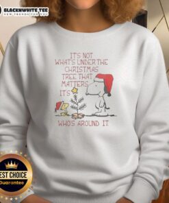 Cozy sweatshirt featuring Snoopy and Woodstock with the quote about Christmas, perfect for holiday gatherings.