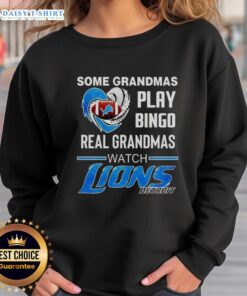 Funny sweatshirt: 'Good Some Grandmas Play Bingo, Real Grandmas Watch Detroit Lions Football' for NFL fans.