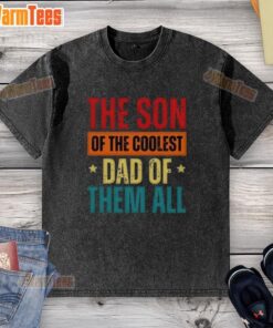 Good The Son Of The Coolest Dad Of Them All Father's Day washed t-shirt displayed on a wooden background.
