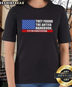 Womens tee featuring the US flag and text 'Good, They Found The Handbook: It's The Constitution' for patriotic style.
