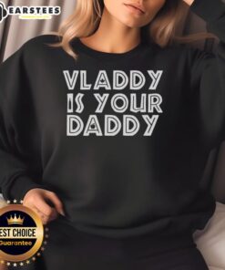 Alt Text: Vladimir Guerrero Jr. in a Toronto Blue Jays sweatshirt with 'Vladdy Is Your Daddy' slogan, showcasing team pride.