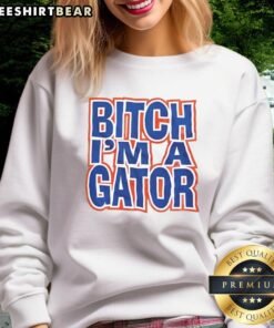 Alt Text: Happy Bitch I'm A Gator sweatshirt featuring a vibrant alligator graphic and bold text, perfect for casual wear.