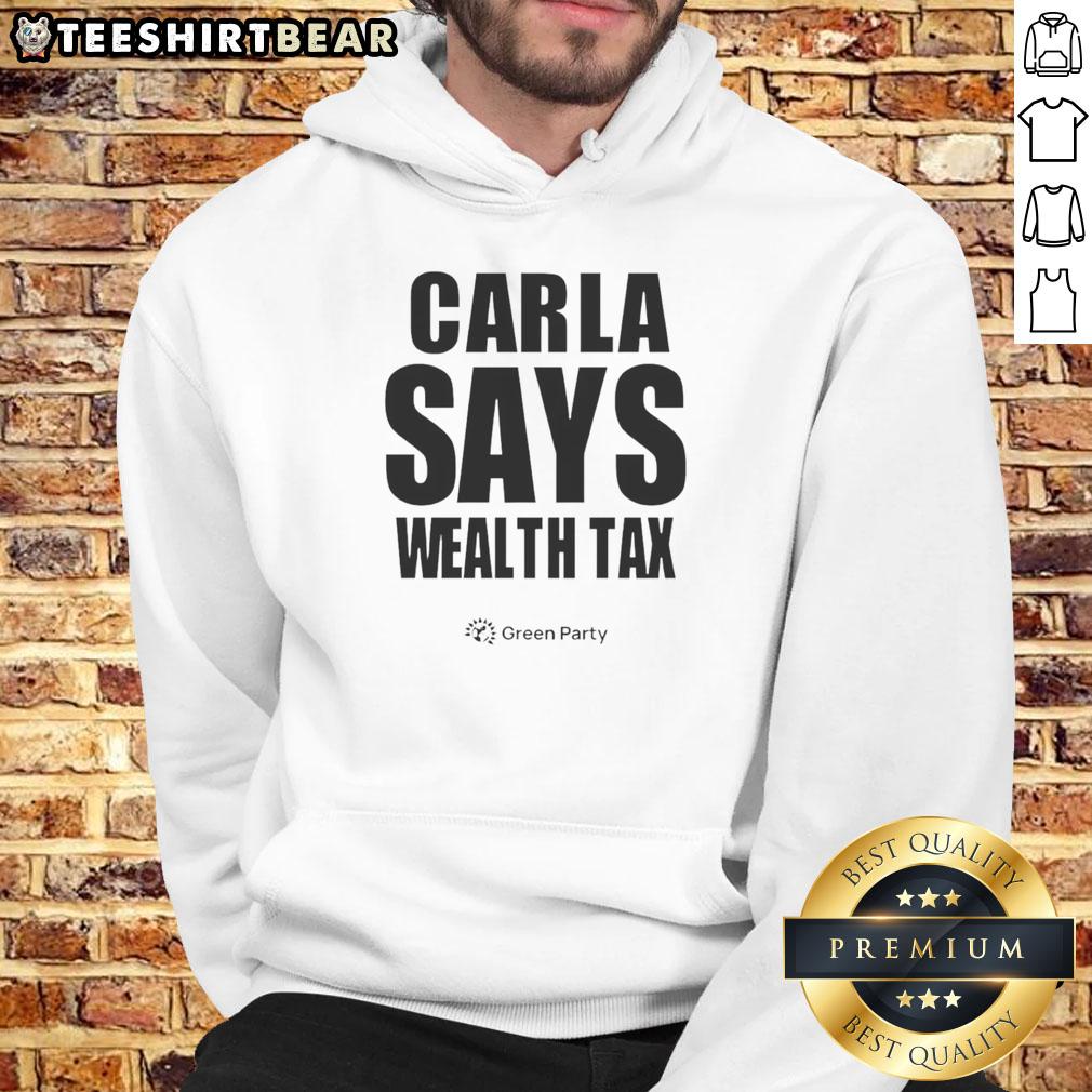 Happy Carla Says Wealth Tax Hoodie Happy Carla wearing a wealth tax hoodie, promoting financial fairness and social equity in a vibrant outdoor setting.