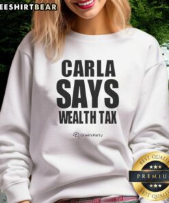 Happy Carla wearing a 'Wealth Tax' sweatshirt, promoting social equity and economic justice through fashion.