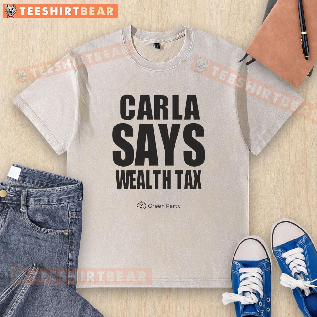 Happy Carla Says Wealth Tax Washed T Shirt Happy Carla wearing a Wealth Tax washed T-shirt, smiling confidently against a vibrant backdrop.