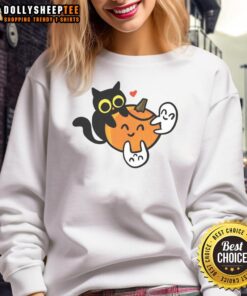 Happy cat in a pumpkin with love ghosts on a cozy sweatshirt, perfect for Halloween festivities.