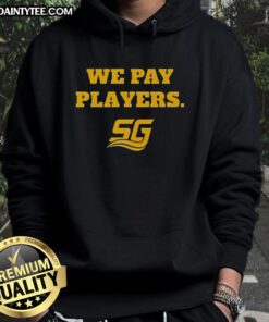 Chad Powers wearing a 'We Pay Players' hoodie, smiling alongside Coach Byrd, showcasing team spirit and enthusiasm.