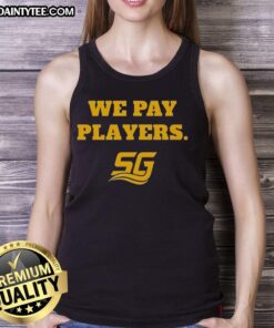 Alt Text: Happy Chad Powers wearing a We Pay Players tank top, showcasing Coach Byrd's vibrant coaching spirit and team pride.