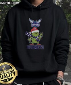 Happy Charlotte Hornets Christmas hoodie featuring Grinch and Santa hat design for the 2025 holiday season.