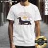 Happy Dachshund dog wearing 'Make Room For Sunlight And A Small Dog's Dreams' t-shirt, radiating joy and positivity.