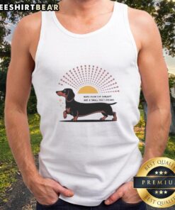 Happy Dachshund dog wearing a tank top that says 'Make Room For Sunlight And A Small Dog's Dreams' in a sunny setting.