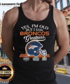 Alt Text: Woman wearing a Denver Broncos tank top that reads 'Yes I'm Old But I Saw Greatness' with a football helmet design.