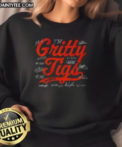 Alt Text: Happy Detroit Tigers baseball players wearing Gritty Tigs signature sweatshirt, showcasing team spirit in 2025.