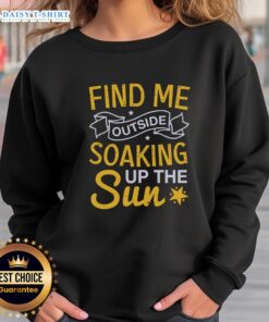 Happy Find Me Outside soaking up the sun sweatshirt worn outdoors, perfect for sunny days and casual comfort.