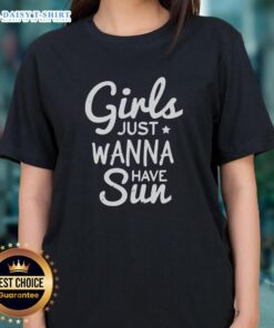 Happy girls wearing a 'Just Wanna Have Sun' Christmas tee, enjoying a sunny holiday gathering outdoors.