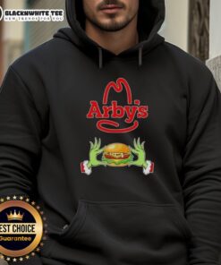 Happy Grinch hands holding an Arby's cup, wearing a Merry Christmas hoodie, celebrating the holiday spirit.