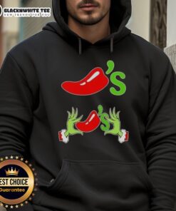 Happy Grinch hands forming a heart shape on a Merry Christmas hoodie, showcasing love for chilis and holiday spirit.