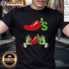 Alt Text: Happy Grinch hands holding a bowl of chili on a festive Merry Christmas T-shirt design.