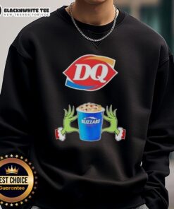 Alt Text: Happy Grinch hands holding a love sign on a Dairy Queen Merry Christmas sweatshirt, perfect for holiday cheer.
