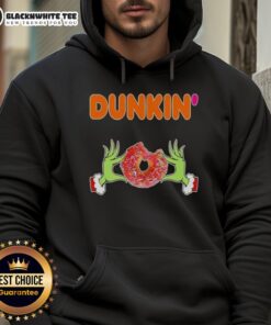 Happy Grinch hands holding a Dunkin' Donut, wearing a Merry Christmas hoodie, perfect for festive celebrations.