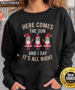 Cozy Christmas sweatshirt featuring 'Here Comes The Sun' text, perfect for festive celebrations and winter outings.