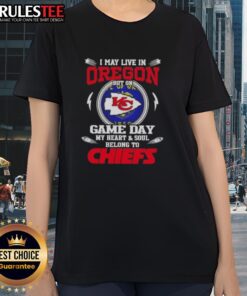 Happy I May Live in Oregon but My Heart Belongs to Kansas City Chiefs Ladies Tee featuring team colors and logo.