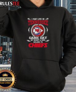 Alt Text: Fan wearing a Kansas City Chiefs hoodie, celebrating game day with pride in Tennessee, showcasing team spirit.