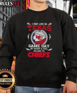 Cozy sweatshirt featuring 'Happy I May Live in Texas But On Game Day My Heart and Soul Belongs to Kansas City Chiefs' design.