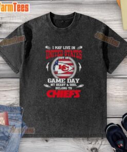 Alt Text: Happy fan wearing a Kansas City Chiefs washed t-shirt, showcasing team spirit on game day in the United States.