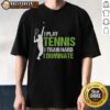 Happy player wearing 'I Play Tennis I Train Hard I Dominate' T-shirt on the court, showcasing passion for tennis.
