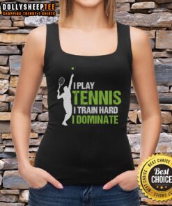 Woman wearing 'Happy I Play Tennis I Train Hard I Dominate' tank top, smiling on a tennis court.