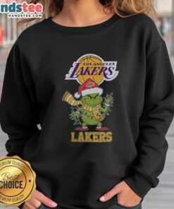 Happy Los Angeles Lakers Christmas sweatshirt featuring Grinch in a Santa hat, perfect for holiday 2025 celebrations.