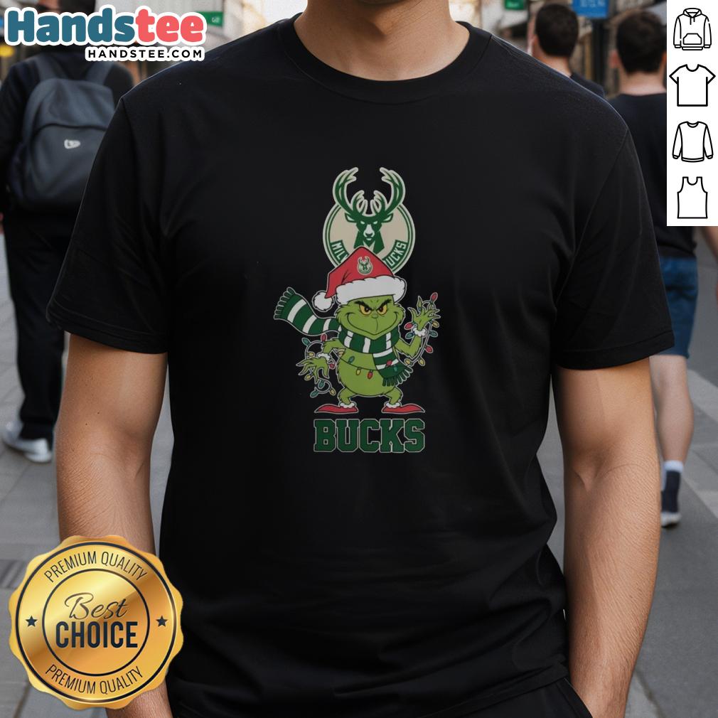 happy-milwaukee-bucks-christmas-grinch-santa-hat-holiday-2025-t-shirt-1 Happy Milwaukee Bucks Christmas Grinch Santa Hat Holiday 2025 T-Shirt featuring festive design and team logo.