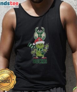 Happy Milwaukee Bucks Christmas tank top featuring Grinch in Santa hat, perfect holiday apparel for fans in 2025.