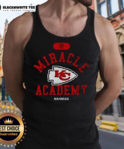 Happy NFL Kansas City Chiefs fan wearing a Nahmias tank top, celebrating team spirit and victory.