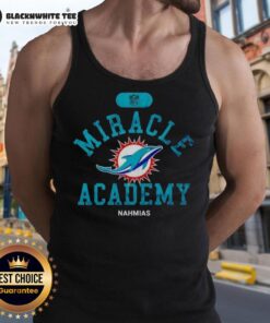 Happy NFL Miami Dolphins fan wearing Nahmias tank top, celebrating a victory at Miracle Academy event.