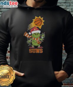 Happy Phoenix Suns fan wearing a Christmas Grinch Santa hat and holiday hoodie for 2025, celebrating the season.