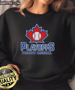 Happy fans wearing Toronto baseball sweatshirts celebrate playoffs excitement at the stadium.