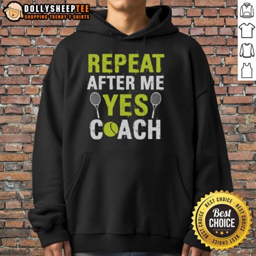 Happy tennis coach wearing 'Repeat After Me Yes' hoodie, inspiring players on the court with positive energy.