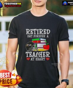 Happy retired teacher wearing a Baltimore Ravens football T-shirt, showcasing pride in education and team spirit.
