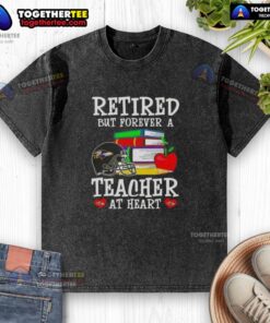 Happy retired teacher wearing a Baltimore Ravens football washed t-shirt, showcasing love for education and sports.