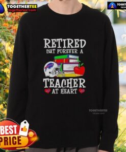 Happy retired teacher wearing a Buffalo Bills football sweatshirt, showcasing love for education and sports.
